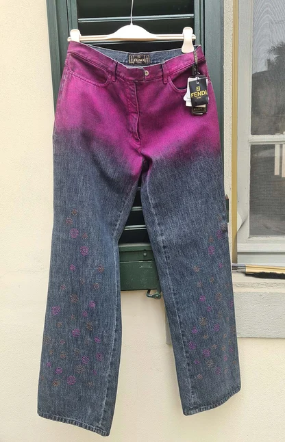 Full length of the magenta-to-blue Fendi jeans with small studded embellishment down the legs