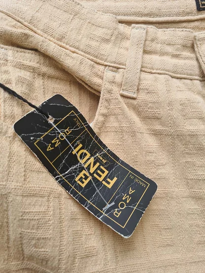 Fendi Jeans, Roma, Made in Italy tag on beige jeans woven with a Fendi logo pattern