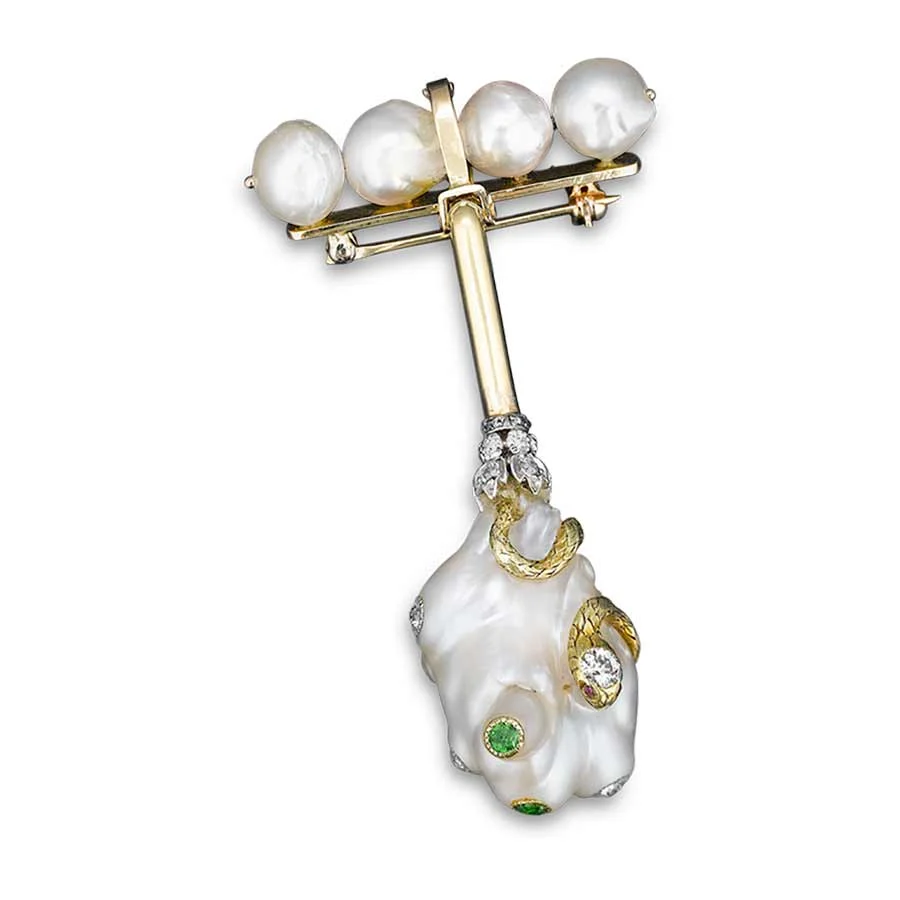 Antique brooch with four baroque pearls on a gold bar above a hanging pearl set with gold snakes, diamonds and green stones