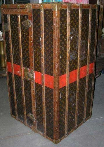 Vintage Louis Vuitton monogram wardrobe trunk with a red band, brass fittings and leather trim