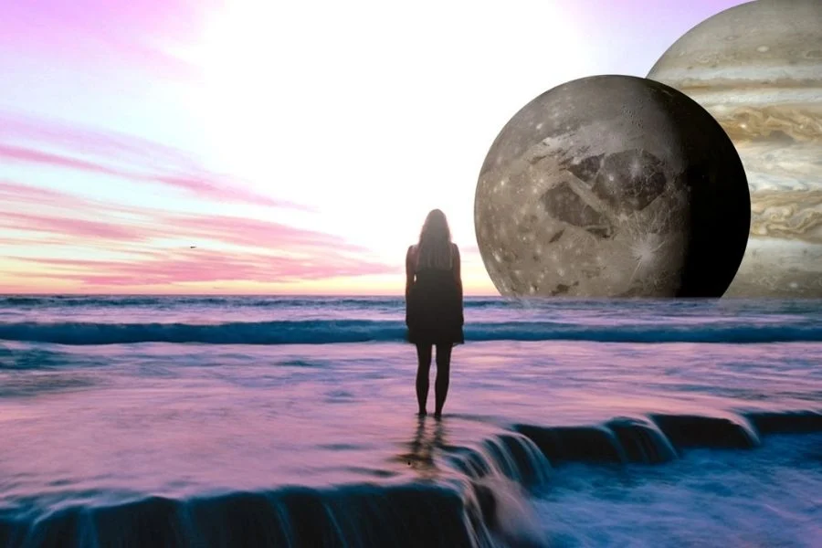 Collage of a woman standing on a pink-lit shoreline, looking at a huge moon and Jupiter rising over the sea